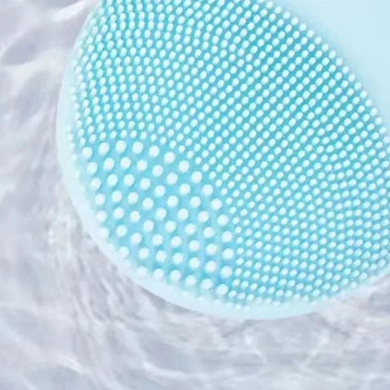 DoubleMfashion Sonic Facial Cleansing Brush in light pink, featuring soft bristles for gentle, effective skin cleansing.