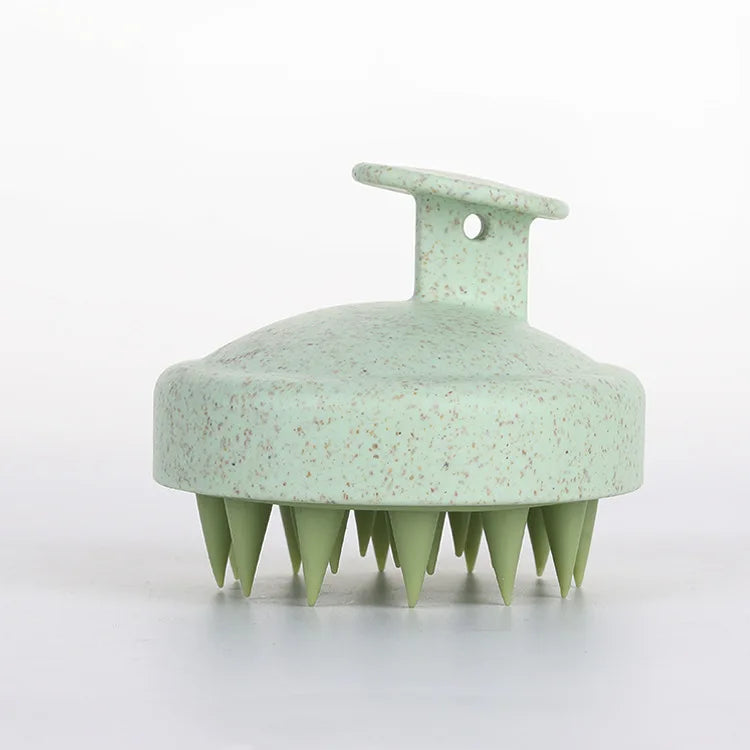 Silicone scalp massage brush by DoubleMfashion, featuring soft bristles and an ergonomic design for a soothing experience.