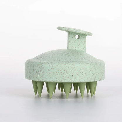 Silicone scalp massage brush by DoubleMfashion, featuring soft bristles and an ergonomic design for a soothing experience.