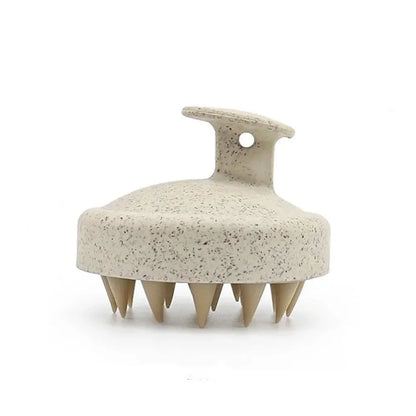 Silicone scalp massage brush by DoubleMfashion, featuring soft bristles and a comfortable grip for effective scalp care.