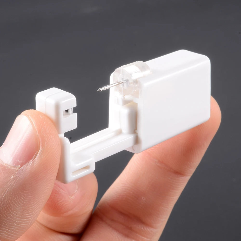 Disposable ear piercing gun kit by DoubleMfashion with studs and nose ring tools for safe body jewelry piercing.