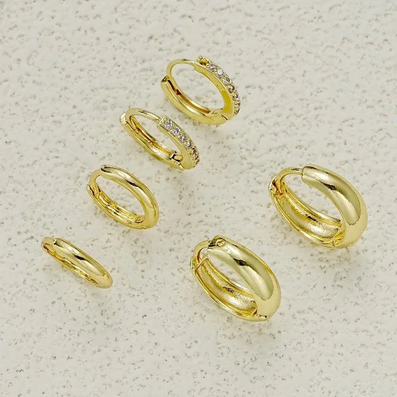 Three pairs of gold-plated stainless steel hoop earrings with crystal zirconia, ideal for women’s punk jewelry.