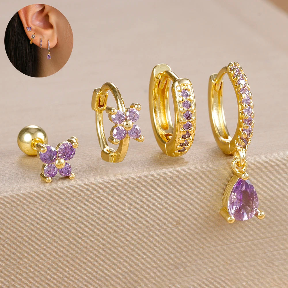 Set of 4 small hoop earrings featuring zircon star, moon, and flower designs in stainless steel by DoubleMfashion.