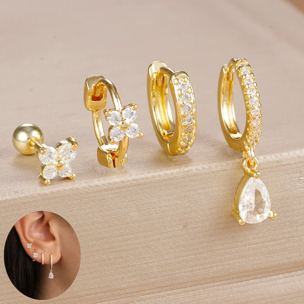 Set of 4 small hoop earrings featuring zircon star, moon, and flower designs by DoubleMfashion in stainless steel.