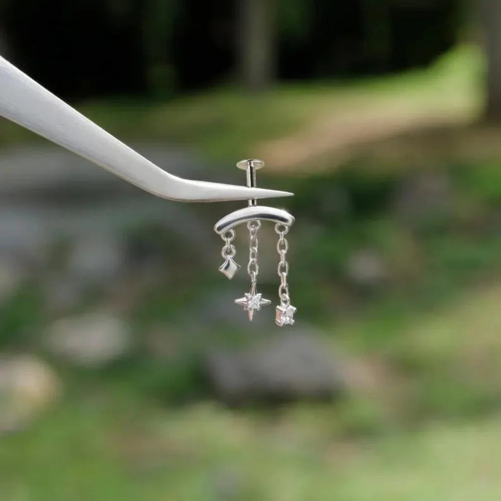 CANNER 925 sterling silver eight-pointed star CZ piercing earring with tassel chain, designed for women.