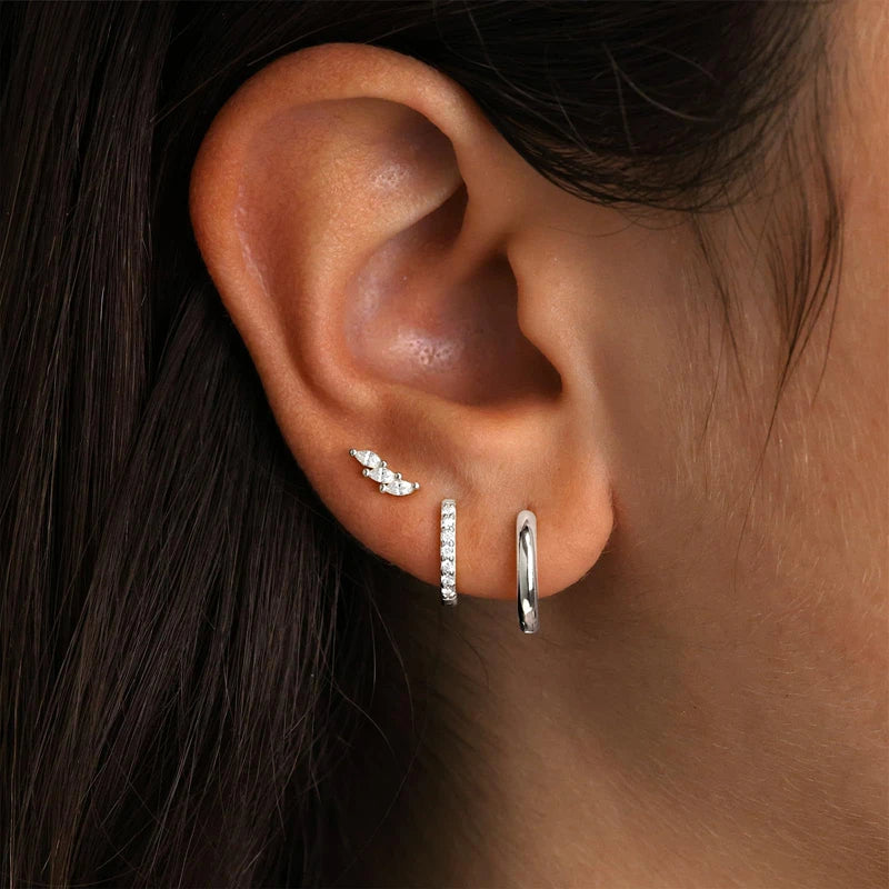 Three-piece stainless steel gold hoop earrings set with zircon flower stud earrings for women, showcasing simple elegance.