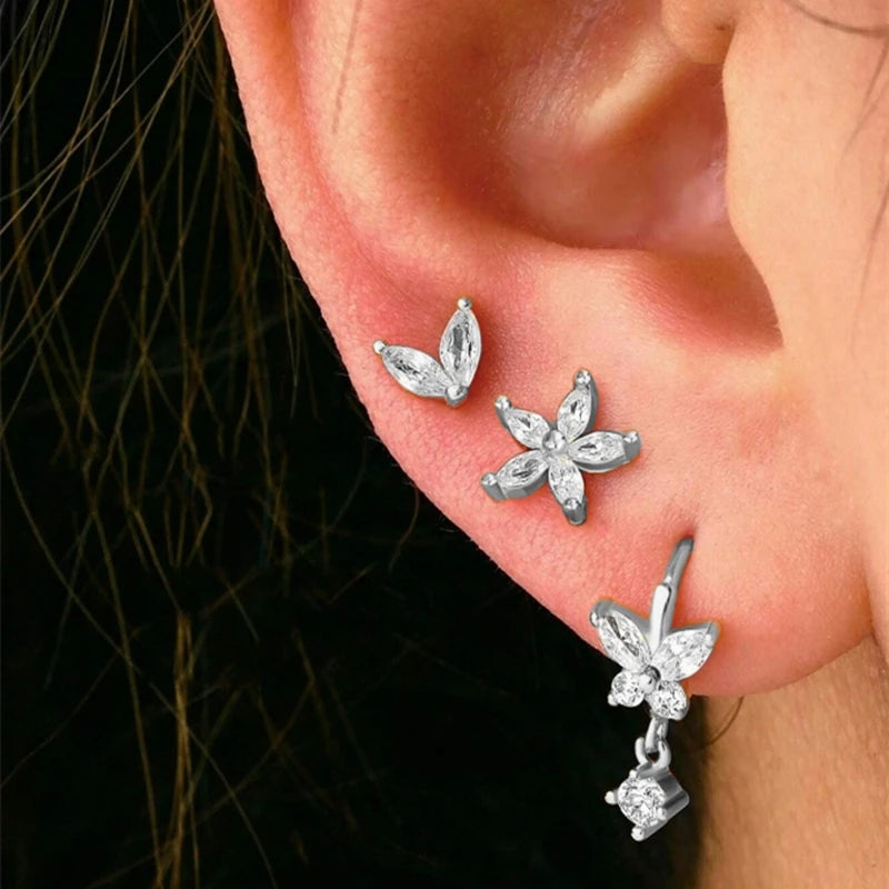 3PCS gold stainless steel hoop earrings set with zircon flower stud earrings for women, featuring various styles.