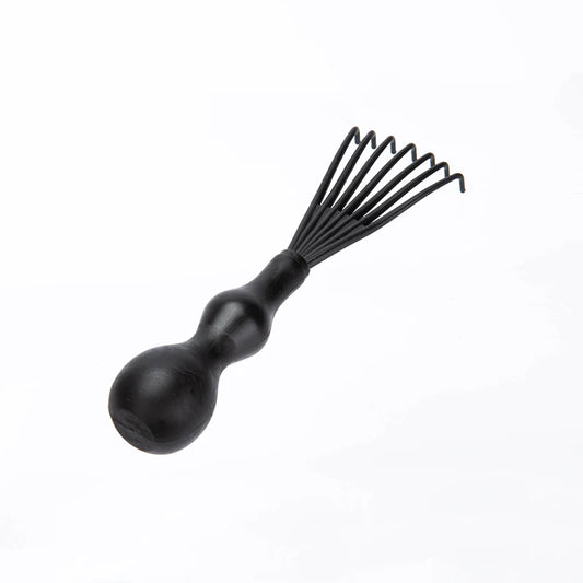 Magic Detangling Hair Brush by Stone's Store with flexible bristles, designed to effortlessly remove knots from hair.