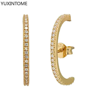 Minimalist 925 sterling silver needle stud earrings with crystal accents, designed for women’s luxury jewelry and piercings.