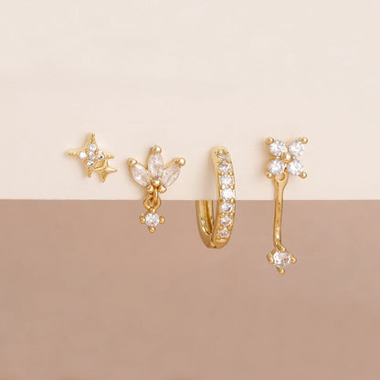 Set of 4 small hoop earrings featuring star, moon, and flower designs in stainless steel by DoubleMfashion.