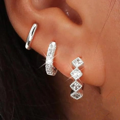 3PCS gold stainless steel circle hoop earrings set with zircon flower studs for women's cartilage piercing jewelry.