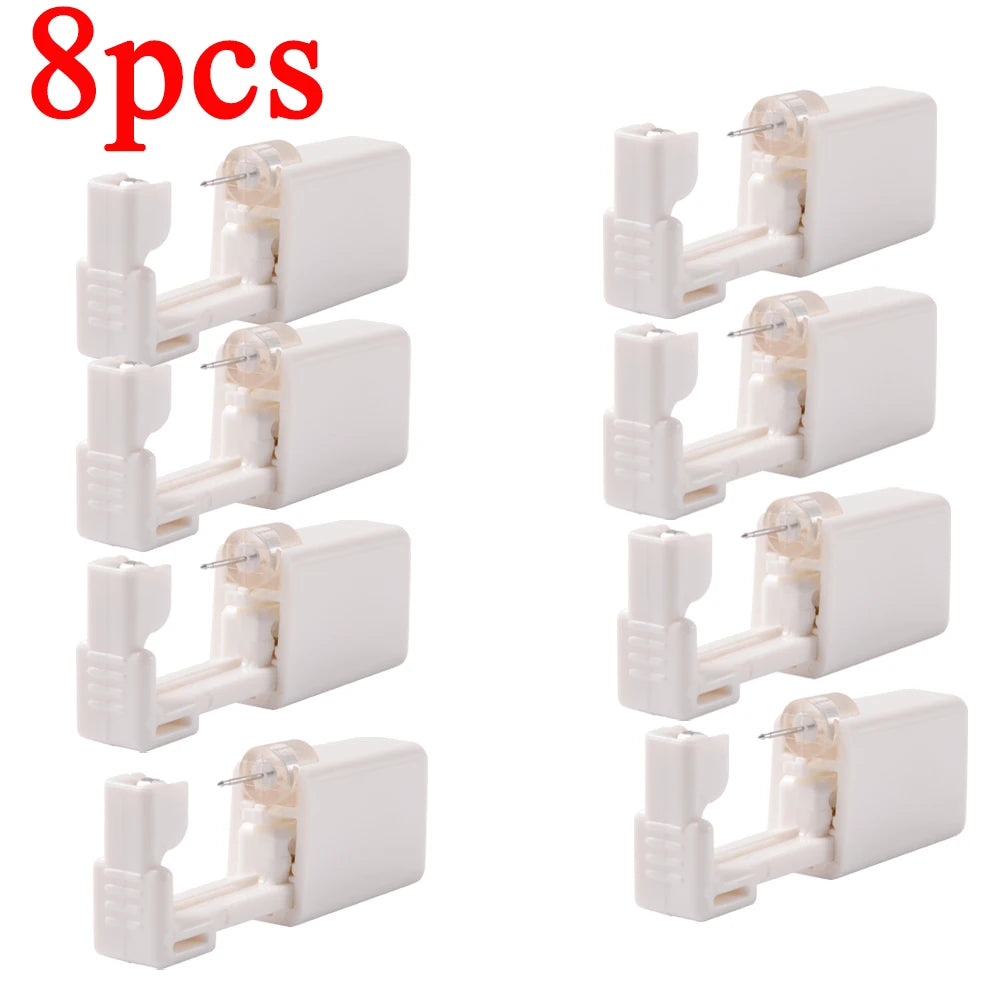 Disposable ear piercing gun kit with studs and nose ring tools by DoubleMfashion, shown in a clean, organized layout.