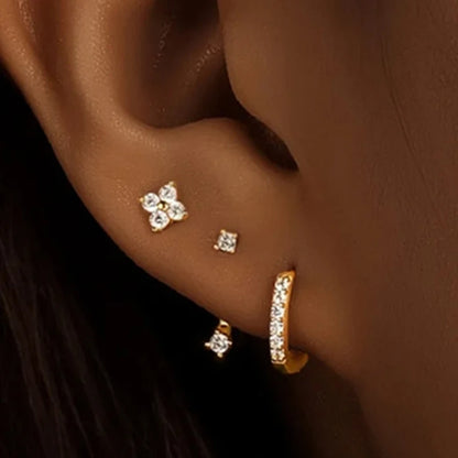 3PCS gold stainless steel hoop earrings set with zircon flower studs, perfect for women’s cartilage piercing jewelry.