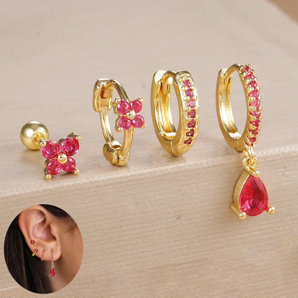 Set of 4 small hoop earrings featuring zircon star, moon, and flower designs in stainless steel by DoubleMfashion.