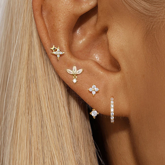 Four-piece small hoop earrings set featuring zircon star, moon, and flower designs in stainless steel by DoubleMfashion.