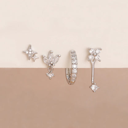 Set of 4 small hoop earrings featuring star, moon, and flower designs in stainless steel by DoubleMfashion.