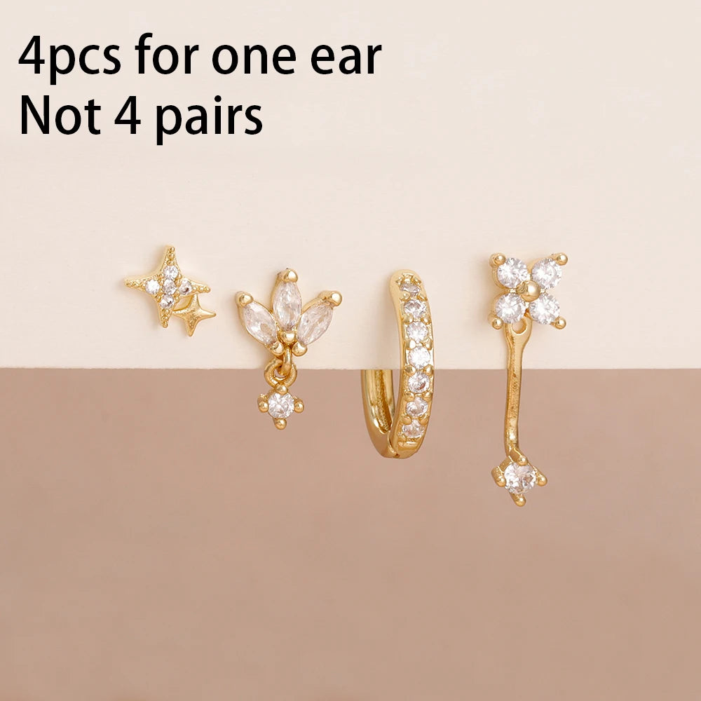 Set of 4 small hoop earrings featuring zircon star, moon, and flower designs in stainless steel by DoubleMfashion.