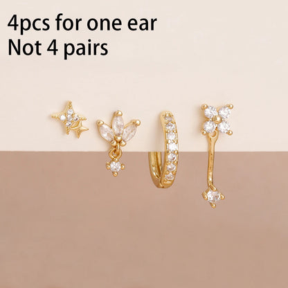 Set of 4 small hoop earrings featuring zircon star, moon, and flower designs in stainless steel by DoubleMfashion.