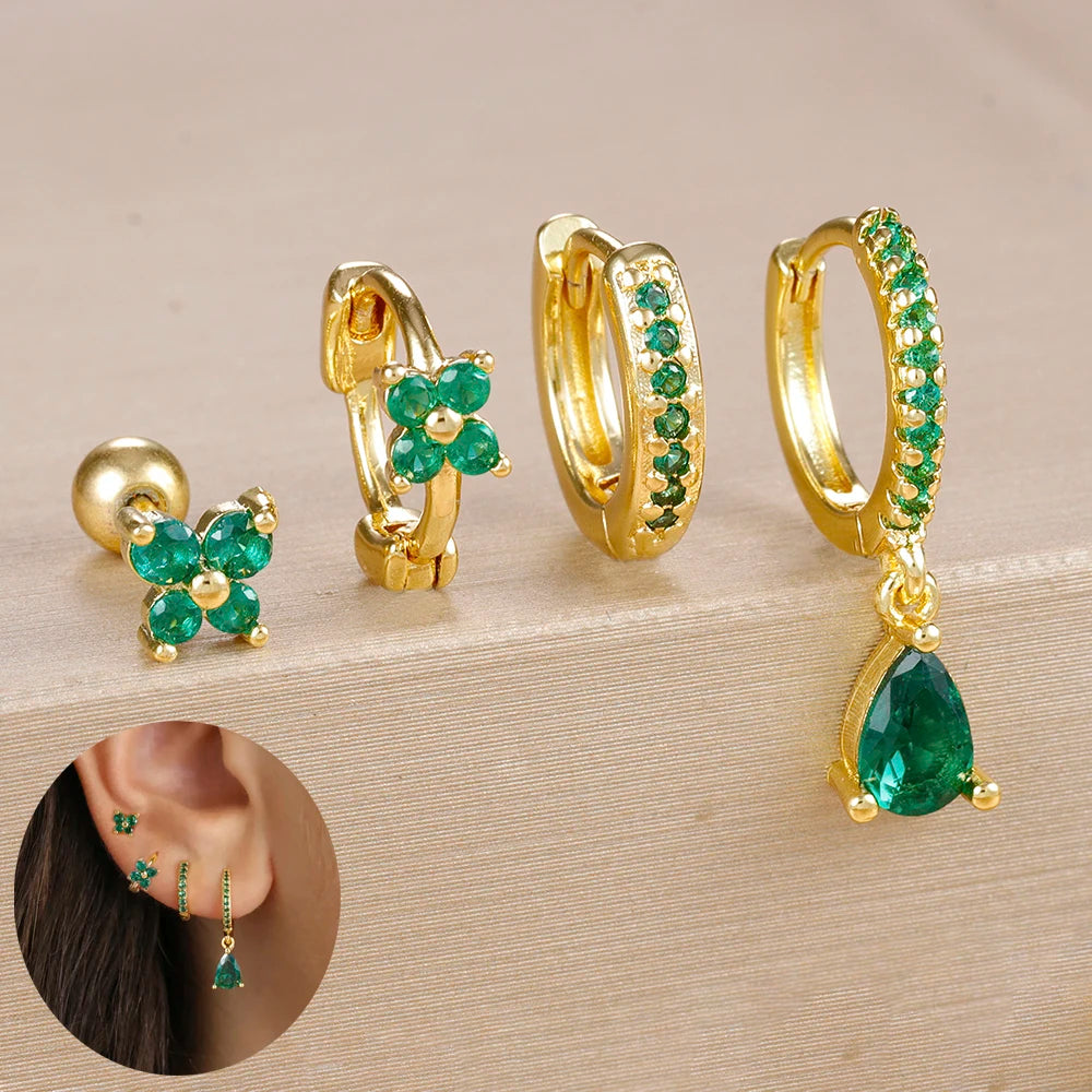 Set of 4 stainless steel small hoop earrings featuring star, moon, and flower designs by DoubleMfashion.