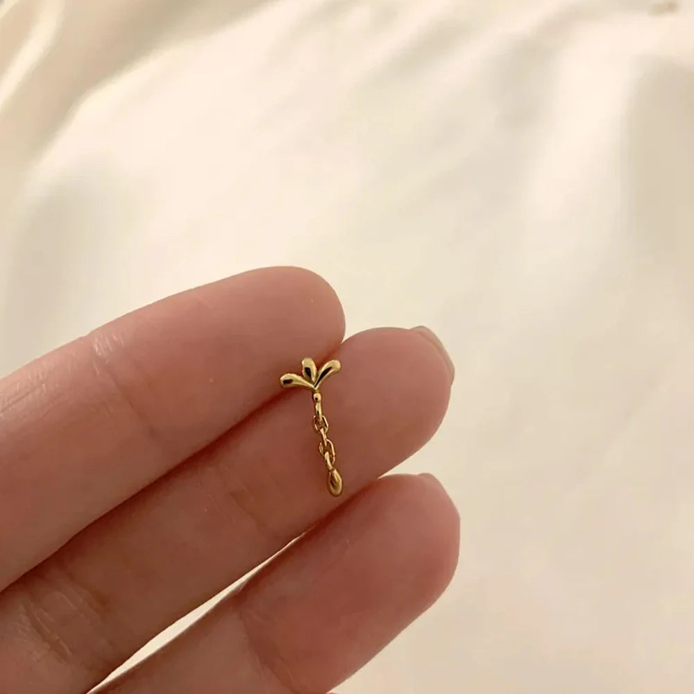 CANNER 925 Sterling Silver eight-pointed star CZ stud earring with tassel chain, designed for women’s fine jewelry.