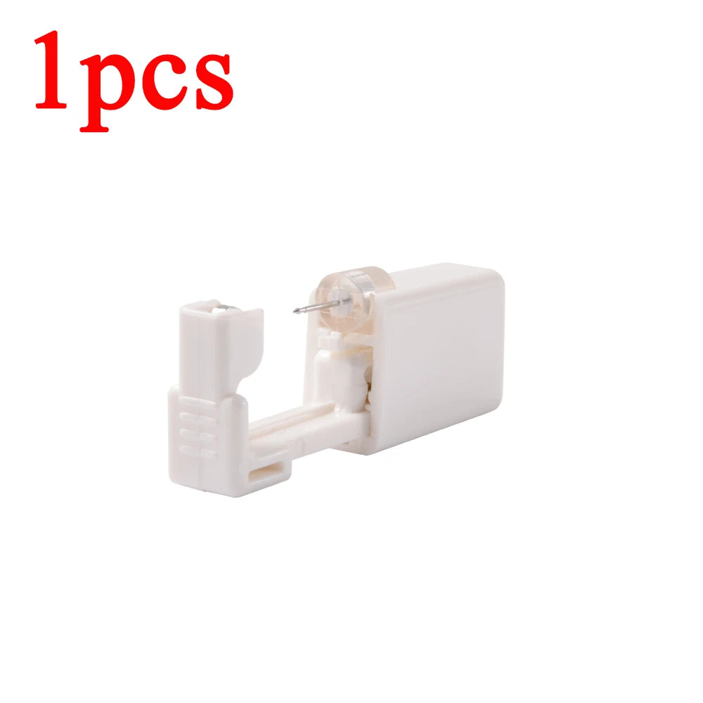 Disposable ear piercing gun kit by DoubleMfashion with various studs and nose ring piercing tools.